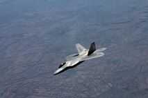 A U.S. Air Force F-22 Raptor flies above Royal Australian Air Force Base Tindal, Australia, March 2, 2017. Twelve F-22 Raptors and approximately 200 U.S. Air Force Airmen participated in the first Enhanced Air Cooperation, an initiative under the Force Posture Agreement between the U.S. and Australia. (U.S. Air Force photo by Maj. Lori Hodge)