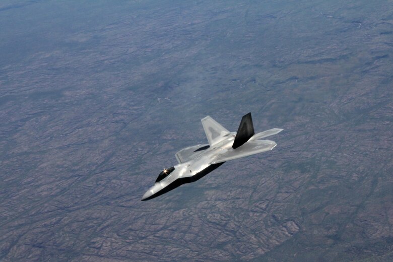A U.S. Air Force F-22 Raptor flies above Royal Australian Air Force Base Tindal, Australia, March 2, 2017. Twelve F-22 Raptors and approximately 200 U.S. Air Force Airmen participated in the first Enhanced Air Cooperation, an initiative under the Force Posture Agreement between the U.S. and Australia. (U.S. Air Force photo by Maj. Lori Hodge)