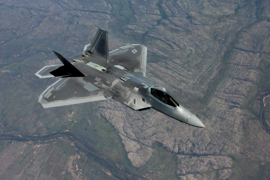 A U.S. Air Force F-22 Raptor flies above Royal Australian Air Force Base Tindal, Australia, March 2, 2017. Twelve F-22 Raptors and approximately 200 U.S. Air Force Airmen participated in the first Enhanced Air Cooperation, an initiative under the Force Posture Agreement between the U.S. and Australia. (U.S. Air Force photo by Maj. Lori Hodge)
