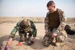 A German trainer observes a Peshmerga soldier attempting to detect improvised explosive devices during training in explosive ordnance disposal and counter IED near Black Tiger Training Camp, Iraq, Feb. 12, 2017. More than 60 Coalition partners have committed themselves to the goal of eliminating the threat posed by ISIS in Iraq and Syria and have contributed in various capacities to the effort. Combined Joint Task Force – Operation Inherent Resolve is the global Coalition to defeat ISIS in Iraq and Syria. (U.S. Army photo by Sgt. Josephine Carlson)