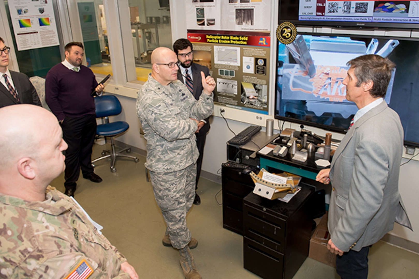 Defense Logistics Agency Aviation Commander Air Force Brig. Gen. Allan Day talks with Victor Champagne, U.S. Army Research Laboratory's Advanced Materials and Processes team leader, during a facilities tour at Aberdeen Proving Ground, Maryland, Feb. 23, 2017.