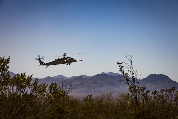 An HH-60G Pave Hawk descends to land in support of a U.S. Air Force and Marine joint exercise as part of a simulated Tactical Recovery of Aircraft and Personnel scenario, Feb 22, 2017, at the Playas Training and Research Center, N.M. During the scenario, Marines from I Marine Expeditionary Force from Marine Corps Base Camp Pendleton, Calif., rescued isolated personnel from a downed aircraft while fending off mock opposition forces from Davis-Monthan Air Force Base, Ariz.’s 563d Operations Support Squadron. This joint effort prepared the IMEF by completing their Special Purpose Marine Air Ground Task Force certification. This is the culmination of their crisis response operations before deploying to the United States Central Command, which consists of 20 countries In Northeast Africa and Southwest Asia. (U.S. Air Force photo by Staff Sgt. Ryan Callaghan)   