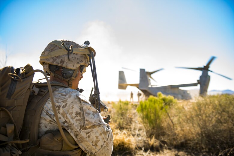 A member of the I Marine Expeditionary Force from Marine Corps Base Camp Pendleton, Calif., secures the perimeter of a landing zone during a simulated Tactical Recovery of Aircraft and Personnel scenario, Feb 22, 2017, at the Playas Training and Research Center, N.M. During the scenario, the IMEF rescued isolated personnel from a downed aircraft while fending off mock opposition forces from Davis-Monthan Air Force Base, Ariz.’s 563d Operations Support Squadron. This joint effort prepared the IMEF by completing their Special Purpose Marine Air Ground Task Force certification. This is the culmination of their crisis response operations before deploying to the United States Central Command, which consists of 20 countries In Northeast Africa and Southwest Asia. (U.S. Air Force photo by Staff Sgt. Ryan Callaghan)   
