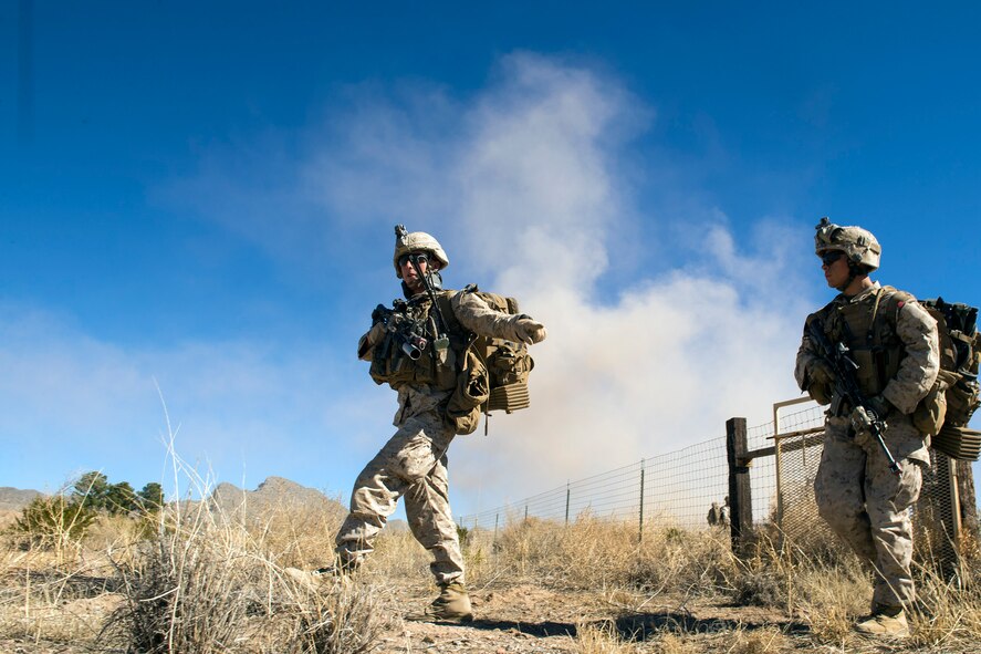 Members of the I Marine Expeditionary Force from Marine Corps Base Camp Pendleton, Calif., advance the desert during a simulated Tactical Recovery of Aircraft and Personnel scenario, Feb 22, 2017, at the Playas Training and Research Center, N.M. During the scenario, the IMEF rescued isolated personnel from a downed aircraft while fending off mock opposition forces from Davis-Monthan Air Force Base, Ariz.’s 563d Operations Support Squadron. This joint effort prepared the IMEF by completing their Special Purpose Marine Air Ground Task Force certification. This is the culmination of their crisis response operations before deploying to the United States Central Command, which consists of 20 countries In Northeast Africa and Southwest Asia. (U.S. Air Force photo by Airman 1st Class Greg Nash)   