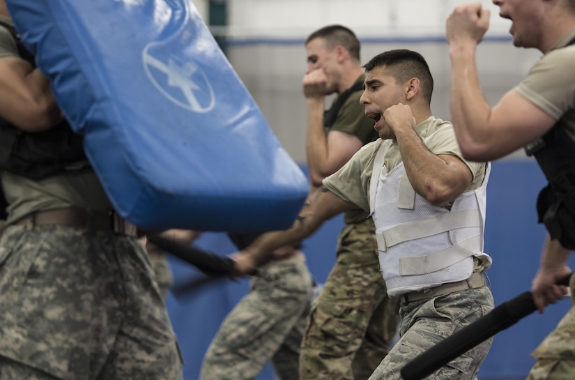 Senior Airman Julio Camacho, Fly-Away Security Team training participant, performs a baton maneuver during the training course, nicknamed “Pre-Raven,” at Joint Base Andrews, Md., Feb. 24, 2017. Camacho and nine other Airmen and Soldiers took the first step to becoming Fly-Away Security Team certified and moving on to possibly earning the title of “Phoenix Raven” during this course. Ravens are specially trained security forces personnel who provide executive aircraft security to Air Force assets. (U.S. Air Force photo by Senior Airman Jordyn Fetter)