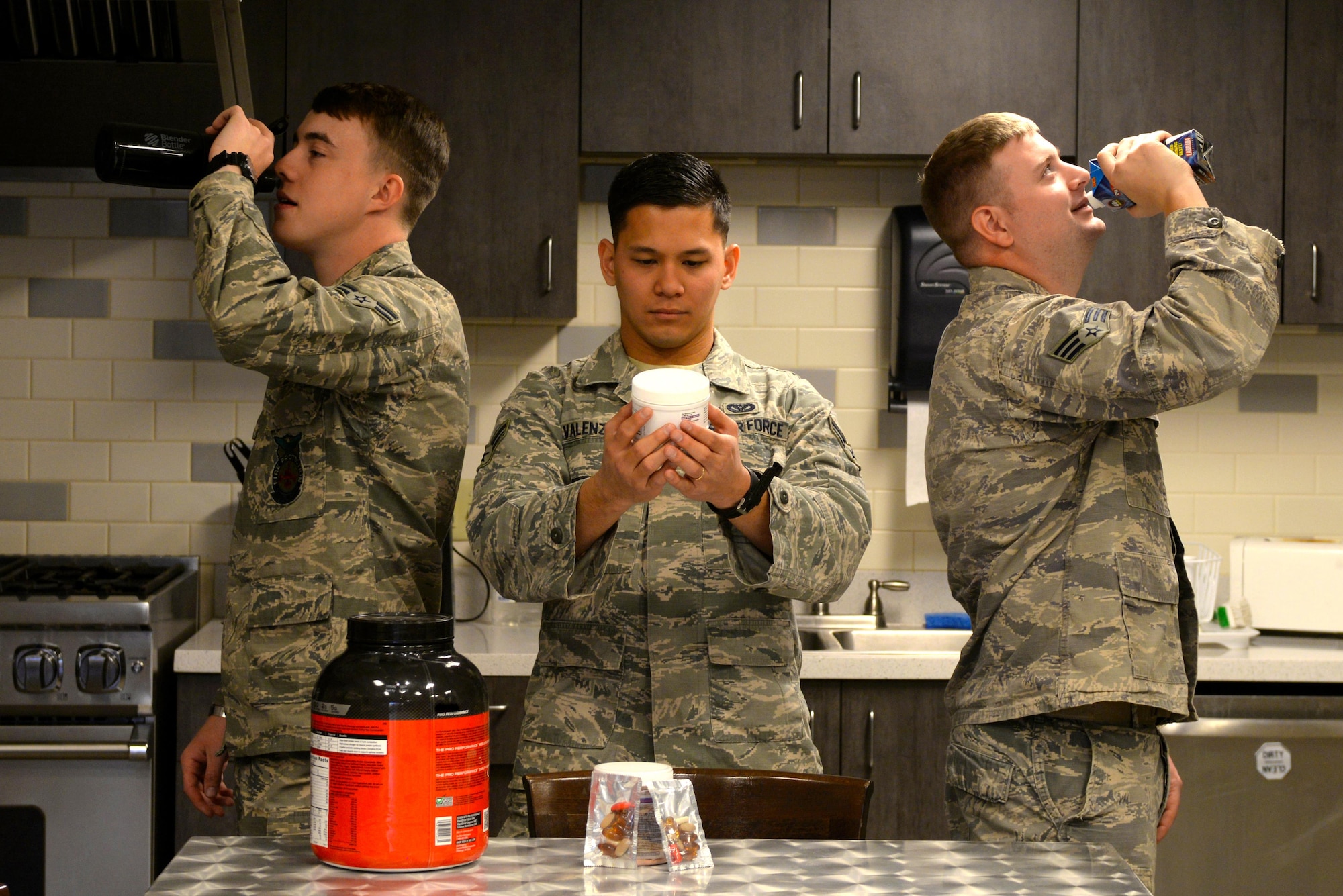 A group of Airmen prepare for their next workout March 2, 2016, at Luke Air Force Base, Ariz. The Airmen gained knowledge from the USAF Human Performance Resource Center website before consuming their supplements.  (U.S. Air Force photo by Airman 1st Class Pedro Mota)
