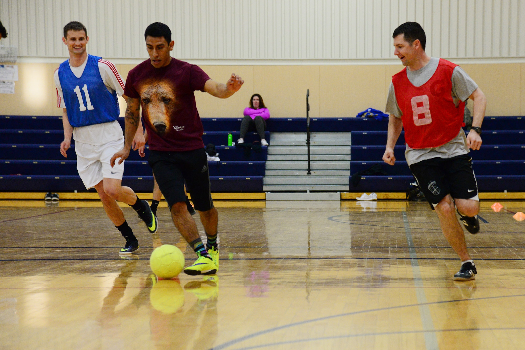 Maj. Jeremiah Kirschman, 341st Contracting Squadron commander, number eight, plays soccer with Airmen Feb. 24, 2017, at Malmstrom Air Force Base, Mont. The fitness center is hosting indoor soccer every Friday 5-7 p.m. at the basketball courts. (U.S. Air Force photo/Airman 1st Class Magen. M. Reeves)