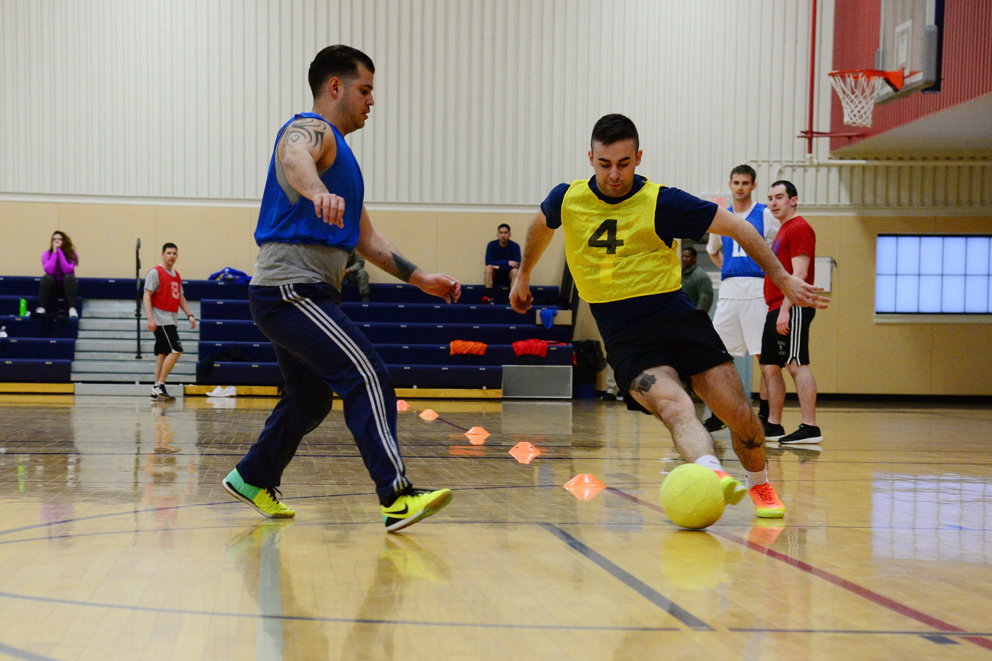 Airmen play indoor soccer at the fitness center Feb. 24, 2017, at Malmstrom Air Force Base, Mont. In addition to playing soccer for fun, the long-term goal is to form a team to represent Malmstrom at the Defender’s Cup, a world-cup type tournament open to base soccer teams representing any branch of service. (U.S. Air Force photo/Airman 1st Class Magen M. Reeves)
