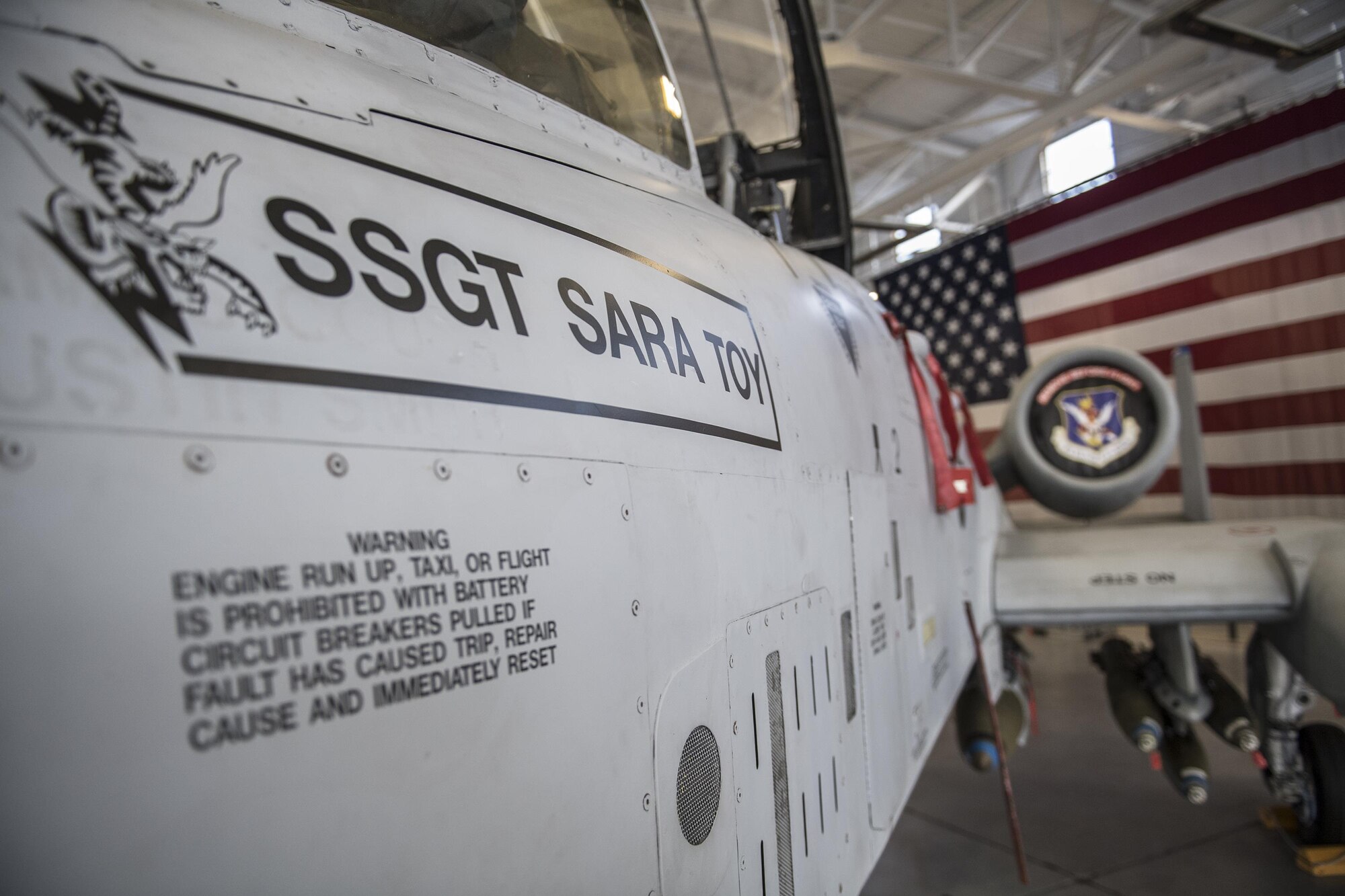 An A-10C Thunderbolt II in the Weapons Load Training hangar dons the name of the late Staff Sgt. Sara Toy, 74th AMU weapons team chief, Feb. 27, 2017, at Moody Air Force Base, Ga. Team Moody’s weapons community wanted to honor Toy, who died in a motor vehicle accident on Feb. 25, 2017, by dedicating the aircraft used for training and certifying all weapons load crew members. (U.S. Air Force photo by Andrea Jenkins/Released)