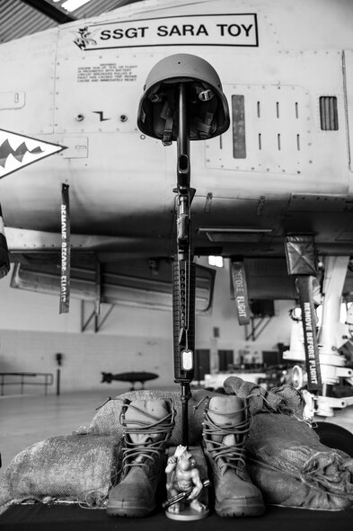 A battlefield cross in honor of the late Staff Sgt. Sara Toy, 74th Aircraft Maintenance Unit weapons team chief, rests on display during a memorial ceremony, March 1, 2017, at Moody Air Force Base, Ga. Toy, a New Kent, Virginia native, died in a car accident Feb. 25, 2017. During the ceremony, she was remembered as a valuable member of the Team Moody weapons community and was posthumously awarded the Air Force Commendation Medal and the rank of Staff Sergeant. (U.S. Air Force photo by Andrea Jenkins/Released)