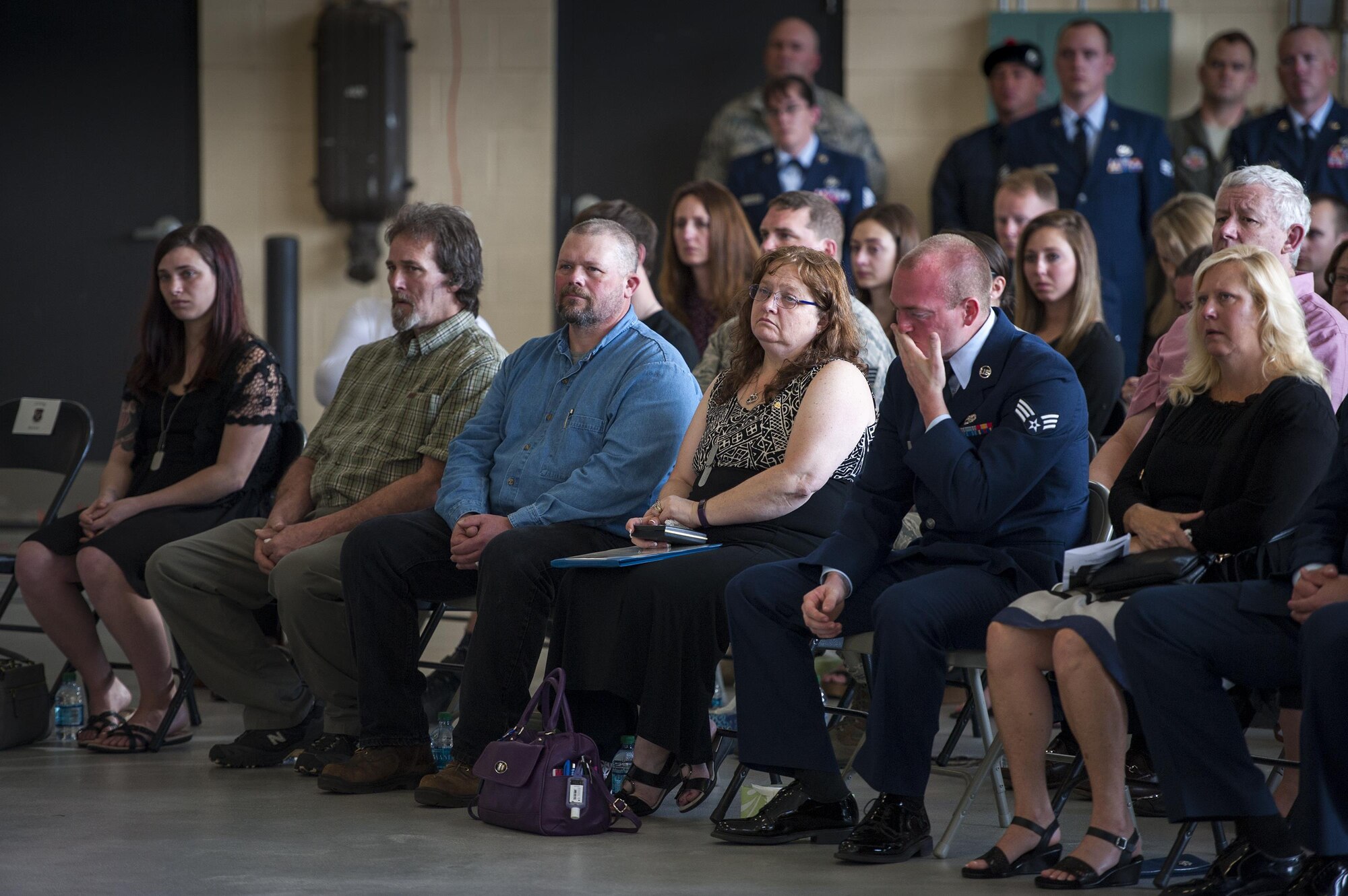Family of the late Staff Sgt. Sara Toy, 74th Aircraft Maintenance Unit weapons team chief, reflect during a memorial ceremony, March 1, 2017, at Moody Air Force Base, Ga. Toy, a New Kent, Virginia native, died in a car accident Feb. 25, 2017. During the ceremony, she was remembered as a valuable member of the Team Moody weapons community and was posthumously awarded the Air Force Commendation Medal and the rank of Staff Sergeant. (U.S. Air Force photo by Andrea Jenkins/Released)