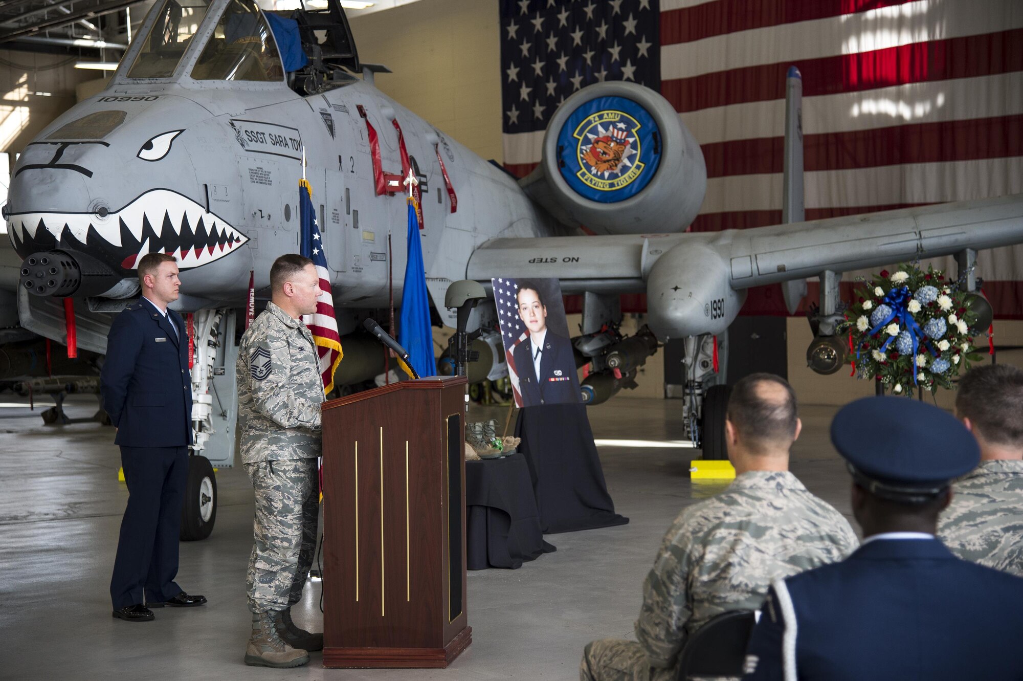 Chief Master Sgt. Mike Lemke, 23d Wing weapons manager, reflects on the memory of the late Staff Sgt. Sara Toy, 74th Aircraft Maintenance Unit weapons team chief, during a memorial ceremony, March 1, 2017, at Moody Air Force Base, Ga. Toy, a New Kent, Virginia native, died in a car accident Feb. 25, 2017. During the ceremony, she was remembered as a valuable member of the Team Moody weapons community and was posthumously awarded the Air Force Commendation Medal and the rank of Staff Sergeant. (U.S. Air Force photo by Andrea Jenkins/Released)