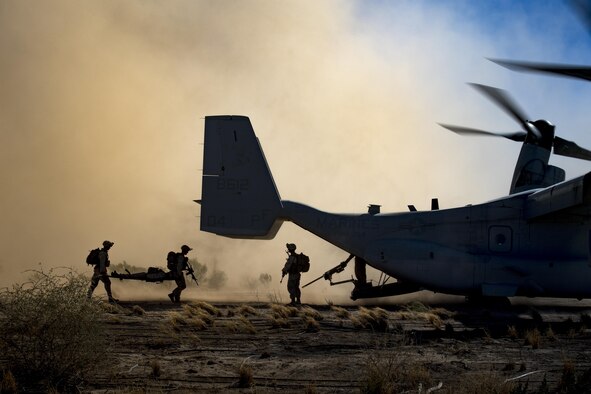 I Marine Expeditionary Force members from Camp Pendleton, Calif., load downed aircrew members into an MV-22 Osprey as part of a simulated Tactical Recovery of Aircraft and Personnel scenario, Feb. 22, 2017, at the Playas Training and Research Center, N.M. During the scenario, the I MEF rescued isolated personnel from a downed aircraft while fending off mock opposition forces from the 563rd Operations Support Squadron, Davis-Monthan Air Force Base, Ariz. (U.S. Air Force photo/Staff Sgt. Ryan Callaghan)