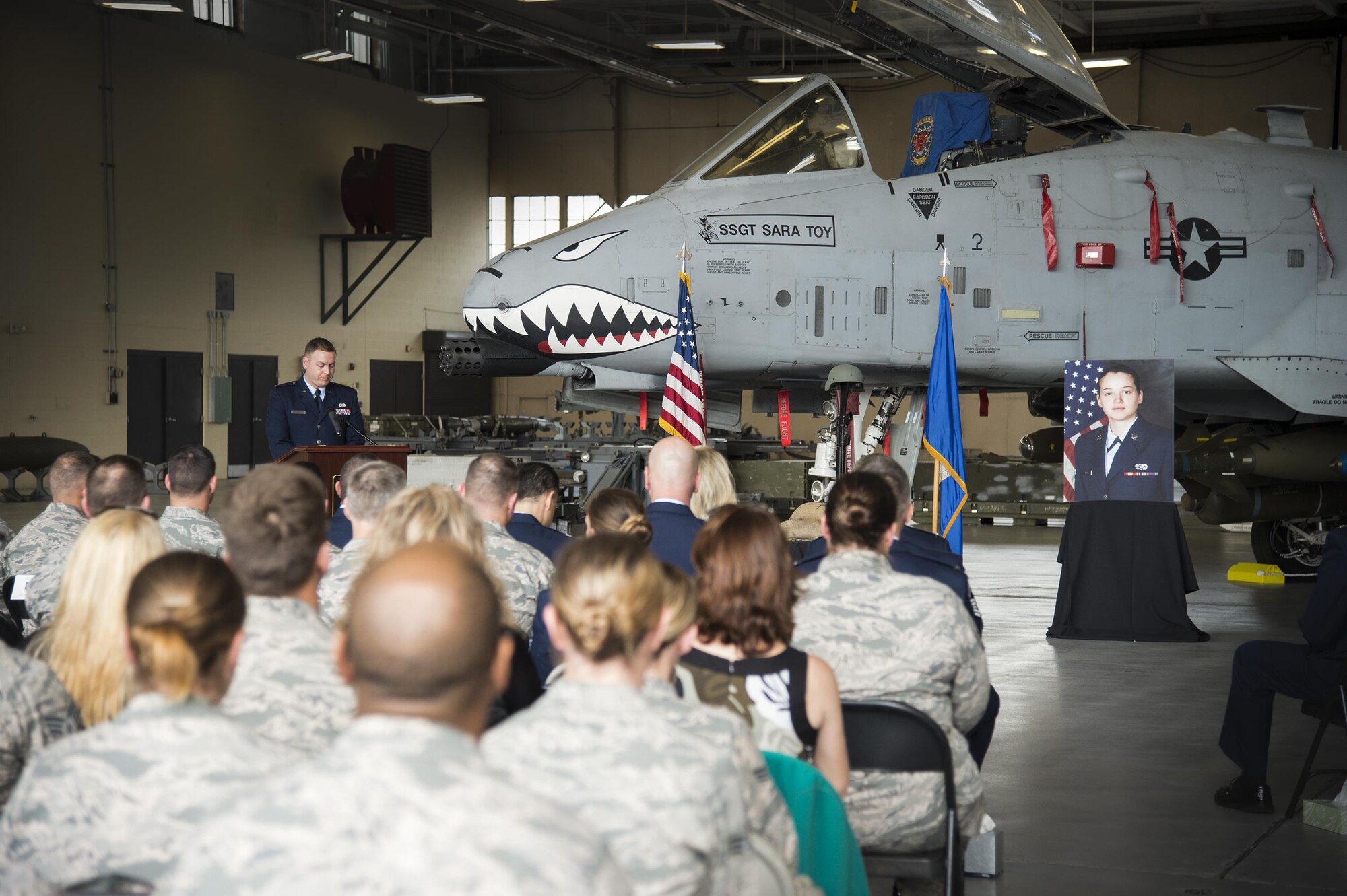 1st Lt. Christopher Burson, 74th Aircraft Maintenance Unit, provides opening remarks during a memorial ceremony in honor of the late Staff Sgt. Sara Toy, 74th Aircraft Maintenance Unit weapons team chief, March 1, 2017, at Moody Air Force Base, Ga. Toy, a New Kent, Virginia native, died in a car accident Feb. 25, 2017. During the ceremony, she was remembered as a valuable member of the Team Moody weapons community and was posthumously awarded the Air Force Commendation Medal and the rank of Staff Sergeant. (U.S. Air Force photo by Andrea Jenkins/Released) 