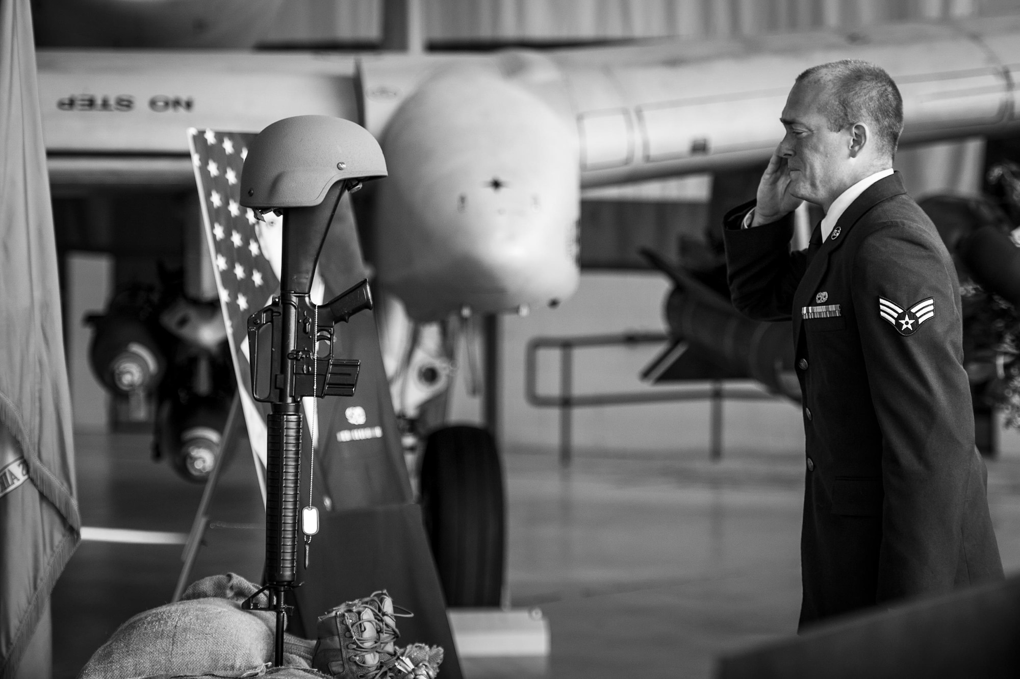 Senior Airman Lucus Zeman, 23d Equipment Maintenance Squadron, renders a final salute to a battlefield cross during a memorial ceremony in honor of his late wife, Staff Sgt. Sara Toy, 74th Aircraft Maintenance Unit weapons team chief, March 1, 2017, at Moody Air Force Base, Ga. Toy, a New Kent, Virginia native, died in a car accident Feb. 25, 2017. During the ceremony, she was remembered as a valuable member of the Team Moody weapons community and was posthumously awarded the Air Force Commendation Medal and the rank of Staff Sergeant. (U.S. Air Force photo by Andrea Jenkins/Released)