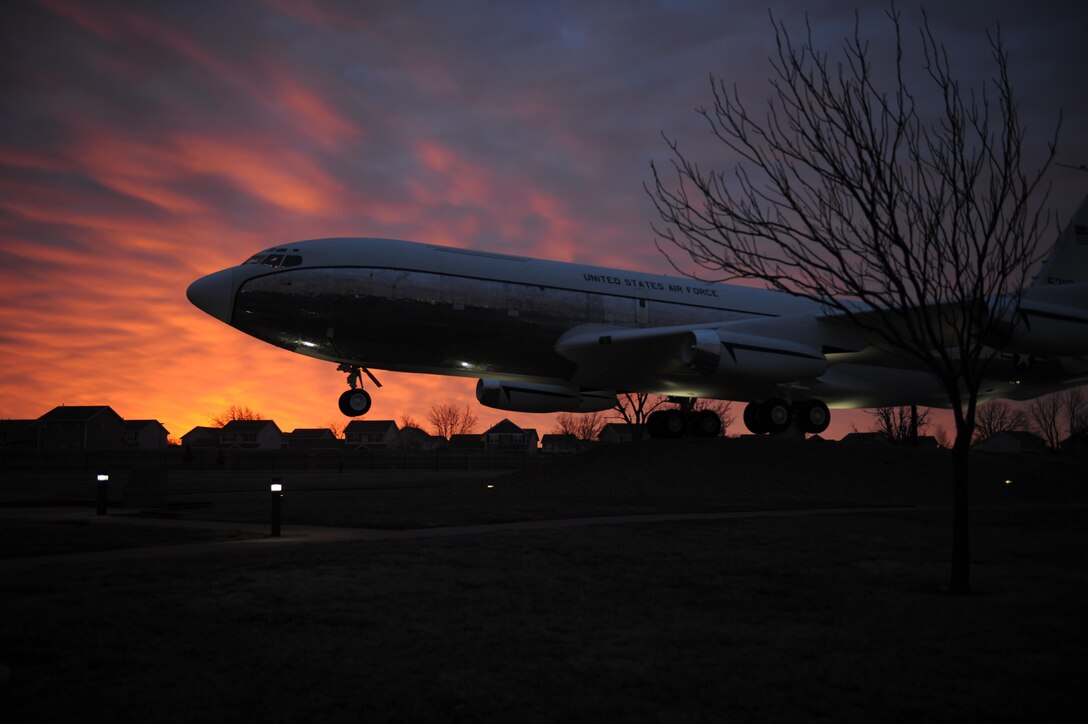 The sun rises behind a KC-135R Stratotanker static display March 2, 2017, at McConnell Air Force Base, Kan. The base is home to a fleet of KC-135s used to provide aerial refueling support to aircraft in the U.S. and across the globe. (U.S. Air Force photo/Senior Airman Tara Fadenrecht)