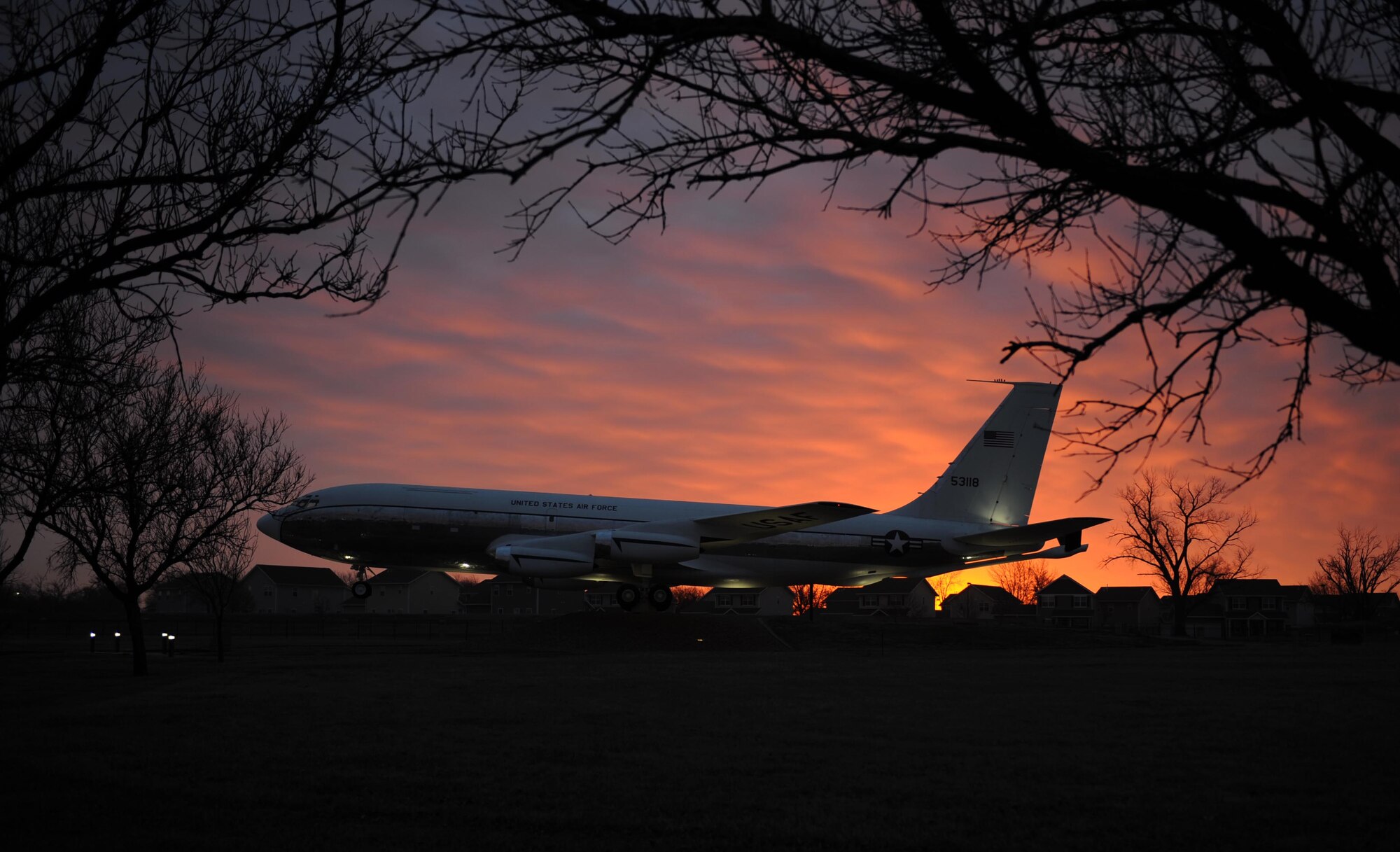 The sun rises behind a KC-135R Stratotanker static display March 2, 2017, at McConnell Air Force Base, Kan. The base is home to a fleet of KC-135s used to provide aerial refueling support to aircraft in the U.S. and across the globe. (U.S. Air Force photo/Senior Airman Tara Fadenrecht)
