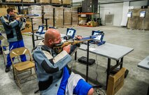 Ryan Novak (left) and Jimmy Counts, Wounded Warriors, compete during the air pistol and rifle shooting portion of the 2017 Air Force Warrior Game Trials March 1 at Nellis Air Force Base, Nev.The trials took place from Feb. 24 to March 3 and also included archery, cycling, rowing, sitting volleyball, swimming, track and field, and wheelchair basketball events.  (U.S. Air Force photo by Senior Airman Alexandria Slade)