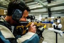 Jeremiah Ellis, Wounded Warrior, focuses on his target during the air pistol and rifle shooting portion of the 2017 Air Force Warrior Game Trials March 1 at Nellis Air Force Base, Nev. Ellis later won the bronze medal in the standing rifle category of the competition. These trials are part of an adaptive sports program, headed by the Air Force Wounded Warrior Program, designed to promote the mental and physical well-being of seriously wounded, ill and injured military members and veterans. (U.S. Air Force photo by Senior Airman Alexandria Slade)