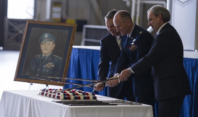 Col. Ryan Samuelson, 92nd Air Refueling Wing commander, Spokane Mayor David Condon, and Todd Mielke, Greater Spokane Incorporated CEO, perform a ceremonial cake cutting during the 75th Anniversary event, March 1, 2017, at Fairchild Air Force Base, Wash. The relationship between Team Fairchild and the community has been beneficial for both, having provided for each other opportunities for recognition and support through events that have taken place in the past 75 years. (U.S. Air Force photo/Airman 1st Class Sean Campbell)