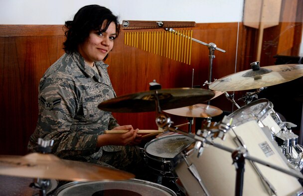 Airman 1st Class Yoli Alvarez Hernandez, 341st Medical Operations Squadron mental health technician, poses for a photo with a drum kit Feb. 28, 2017, at the base chapel at Malmstrom Air Force Base, Mont. Alvarez Hernandez received her first drum set on her fifteenth birthday and has been playing ever since. (U.S. Air Force photo/Airman 1st Class Magen M. Reeves)