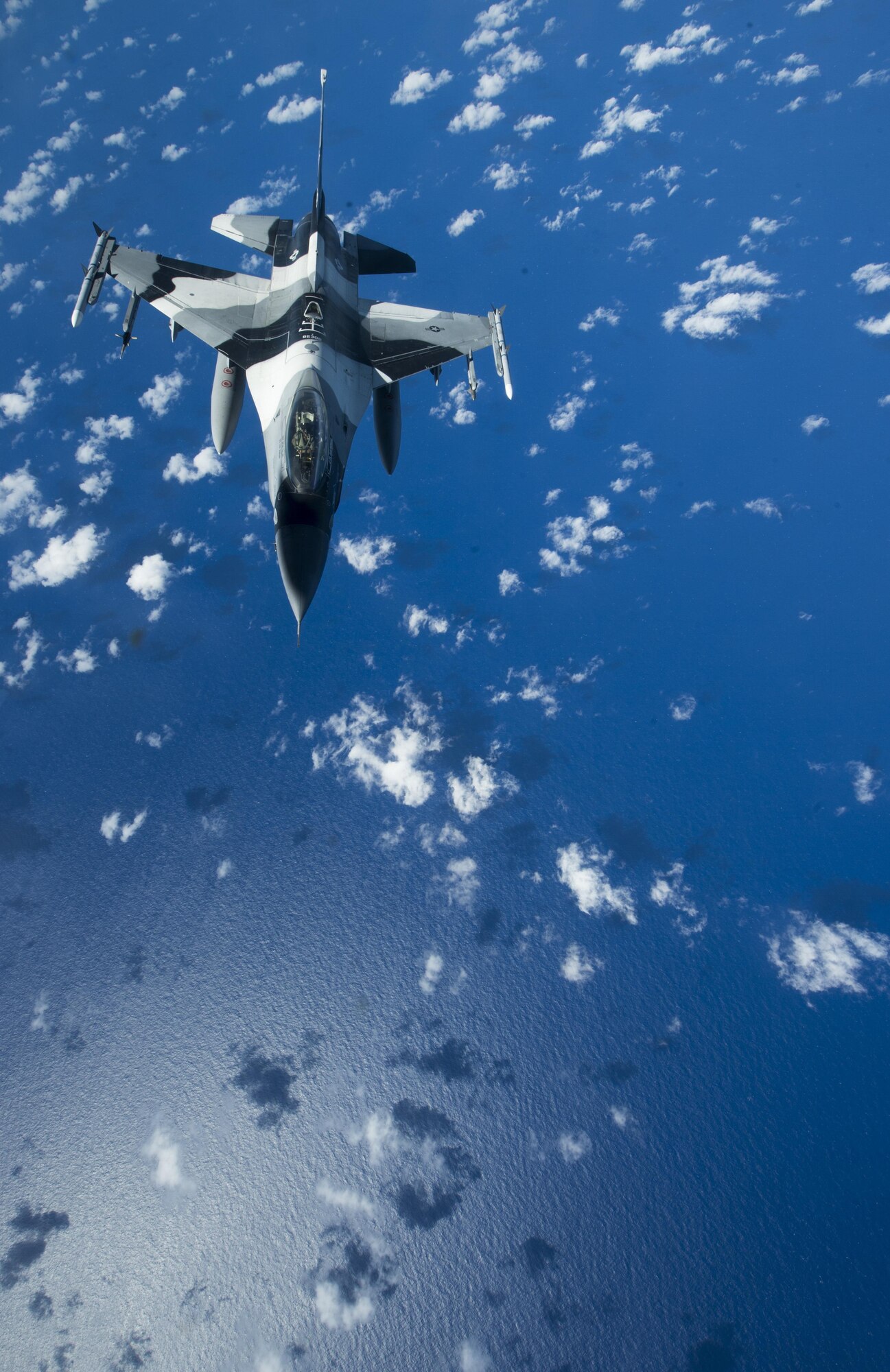 A U.S. Air Force F-16 Fighting Falcon assigned to the 18th Aggressor Squadron makes it way to recieve in-flight fuel from a U.S. Air Force KC-135 Stratotanker during Cope North 17, March 2, 2017. The exercise includes 22 total flying units and more than 2,700 personnel from three countries and continues the growth of strong, interoperable relationships within the Indo-Asia-Pacific region through integration of airborne and land-based command and control assets. (U.S. Air Force photo by Staff Sgt. Keith James)