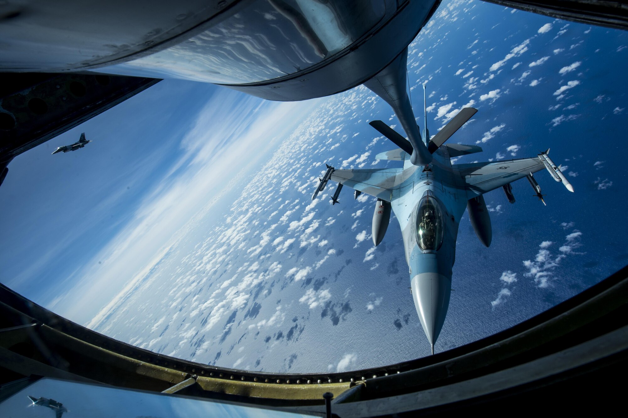 U.S. Air Force F-16 Fighting Falcons assigned to the 18th Aggressor Squadron receives in-flight fuel from a U.S. Air Force KC-135 Stratotanker during Cope North 17, March 2, 2017. The exercise includes 22 total flying units and more than 2,700 personnel from three countries and continues the growth of strong, interoperable relationships within the Indo-Asia-Pacific region through integration of airborne and land-based command and control assets. (U.S. Air Force photo by Staff Sgt. Keith James)