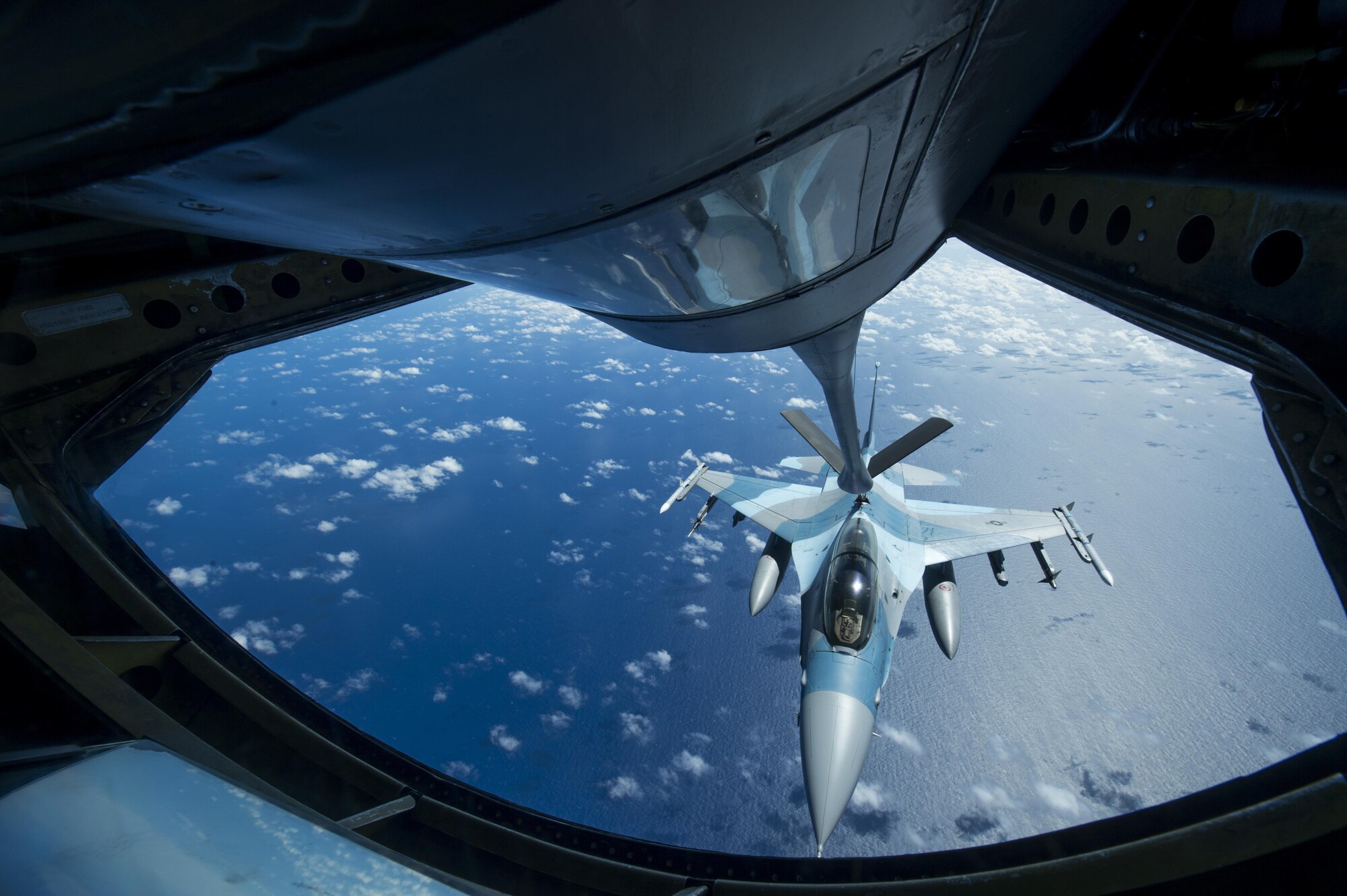 A U.S. Air Force F-16 Fighting Falcon assigned to the 18th Aggressor Squadron receives in-flight fuel from a U.S. Air Force KC-135 Stratotanker during Cope North 17, March 2, 2017. The exercise includes 22 total flying units and more than 2,700 personnel from three countries and continues the growth of strong, interoperable relationships within the Indo-Asia-Pacific region through integration of airborne and land-based command and control assets. (U.S. Air Force photo by Staff Sgt. Keith James)