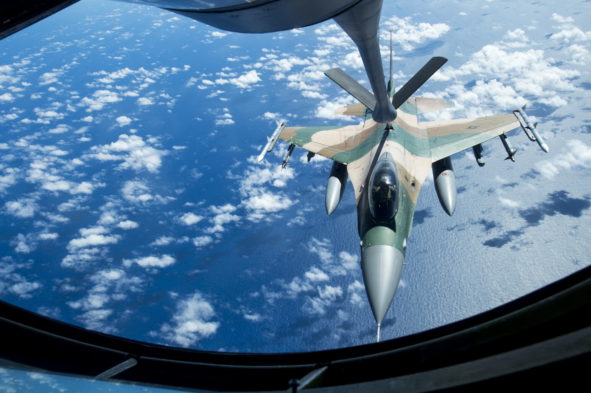 A U.S. Air Force F-16 Fighting Falcon assigned to the 18th Aggressor Squadron receives in-flight fuel from a U.S. Air Force KC-135 Stratotanker during Cope North 17, March 2, 2017. The exercise includes 22 total flying units and more than 2,700 personnel from three countries and continues the growth of strong, interoperable relationships within the Indo-Asia-Pacific region through integration of airborne and land-based command and control assets. (U.S. Air Force photo by Staff Sgt. Keith James)