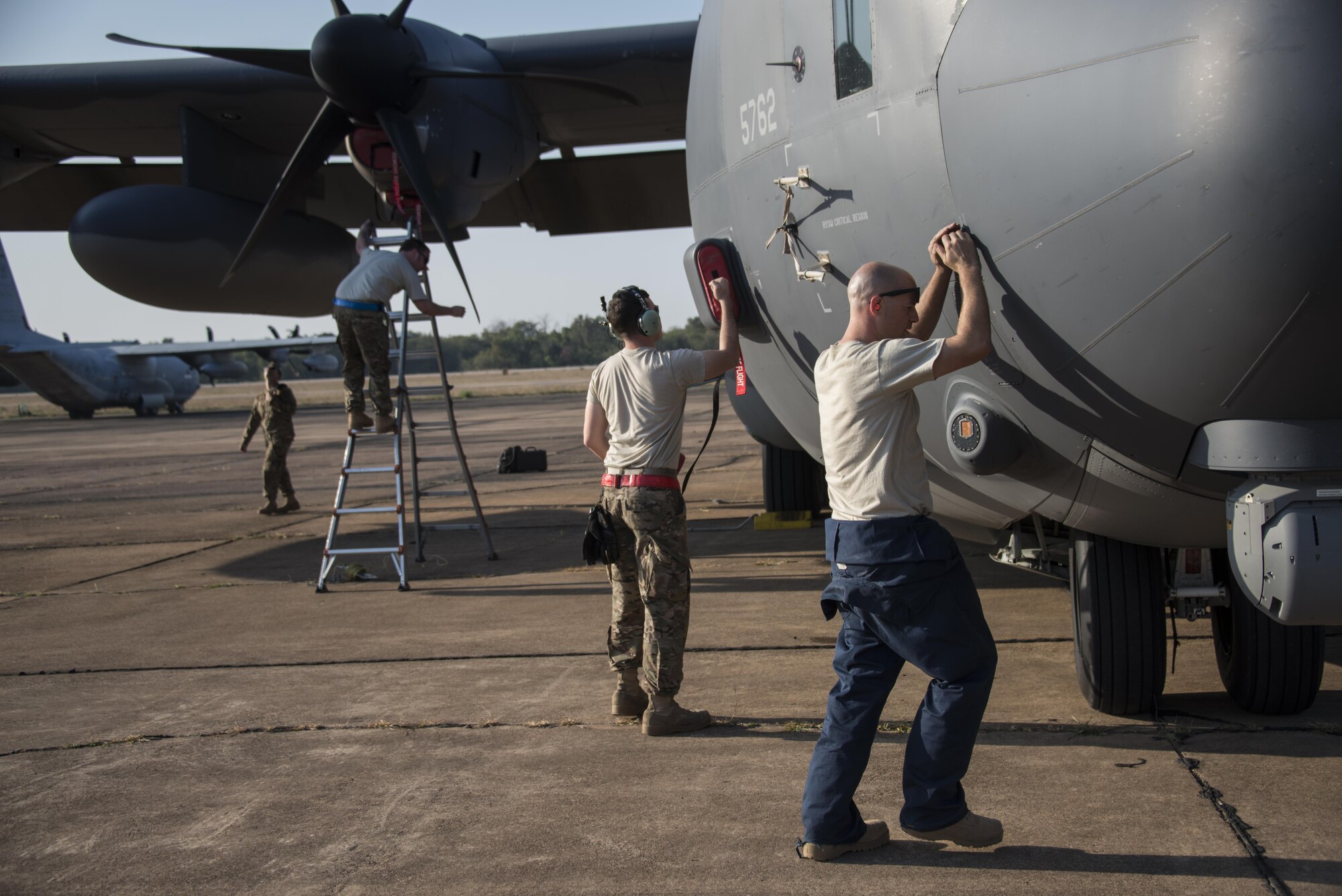 U.S. Air Force maintainers assigned to the 353rd Special Operations Maintenance Squadron, work on a U.S. Air Force MC-130J Commando II following jump operations by combat controllers and pararesucemen assigned to the 320th Special Tactics Squadron and Royal Thai Air Force Special Operations Regiment, Feb. 17, 2017 at Korat Air Base, Thailand. Leading up to Cobra Gold 2017, members of the 353rd SOMXS strengthened the long-standing partnership with the Royal Thai Air Force through a maintenance exchange, Feb. 6-9, 2017 at Don Mueang Air Base, Thailand. (U.S. Air Force photo by Capt. Jessica Tait)