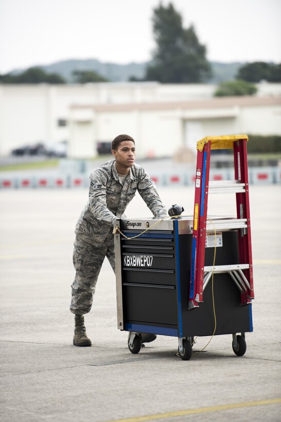 U.S. Air Force Airman 1st Class Jerrell Starkey, 18th Maintenance Squadron F-15C Eagle crew chief, pushes a toolkit on the flight line Mar. 2, 2017, at Kadena Air Base, Japan. Crew chiefs work alongside other maintainers from the 18th MXS to ensure that 44th Fighter Squadron’s F-15 Eagles are ready to fly night or day. (U.S. Air Force photo by Senior Airman Omari Bernard/Released)