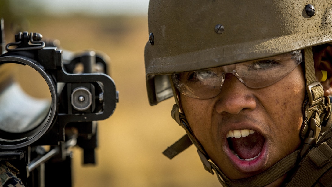 A Marine attending a combat engineer course ensures his back blast area is clear before firing a shoulder-launched multipurpose assault weapon at Camp Lejeune, N.C., Feb. 21, 2017. Marine Corps photo by Cpl. Manuel A. Serrano