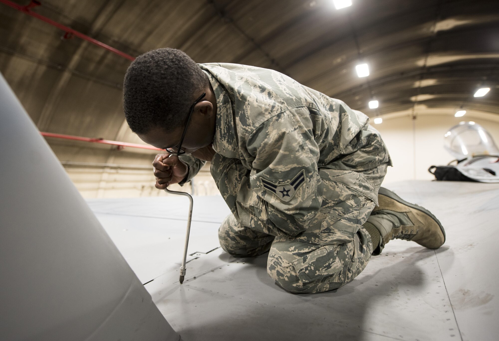 U.S. Air Force Airman 1st Class Emon Kizer, 18th Component Maintenance Squadron electrical and environmental apprentice, practices removing a panel on an F-15A Eagle Feb. 28, 2017, at Kadena Air Base, Japan. Kizer is attending the 18th Maintenance Training Flight’s new ENE core tasks course. (U.S. Air Force photo by Senior Airman Omari Bernard/Released)