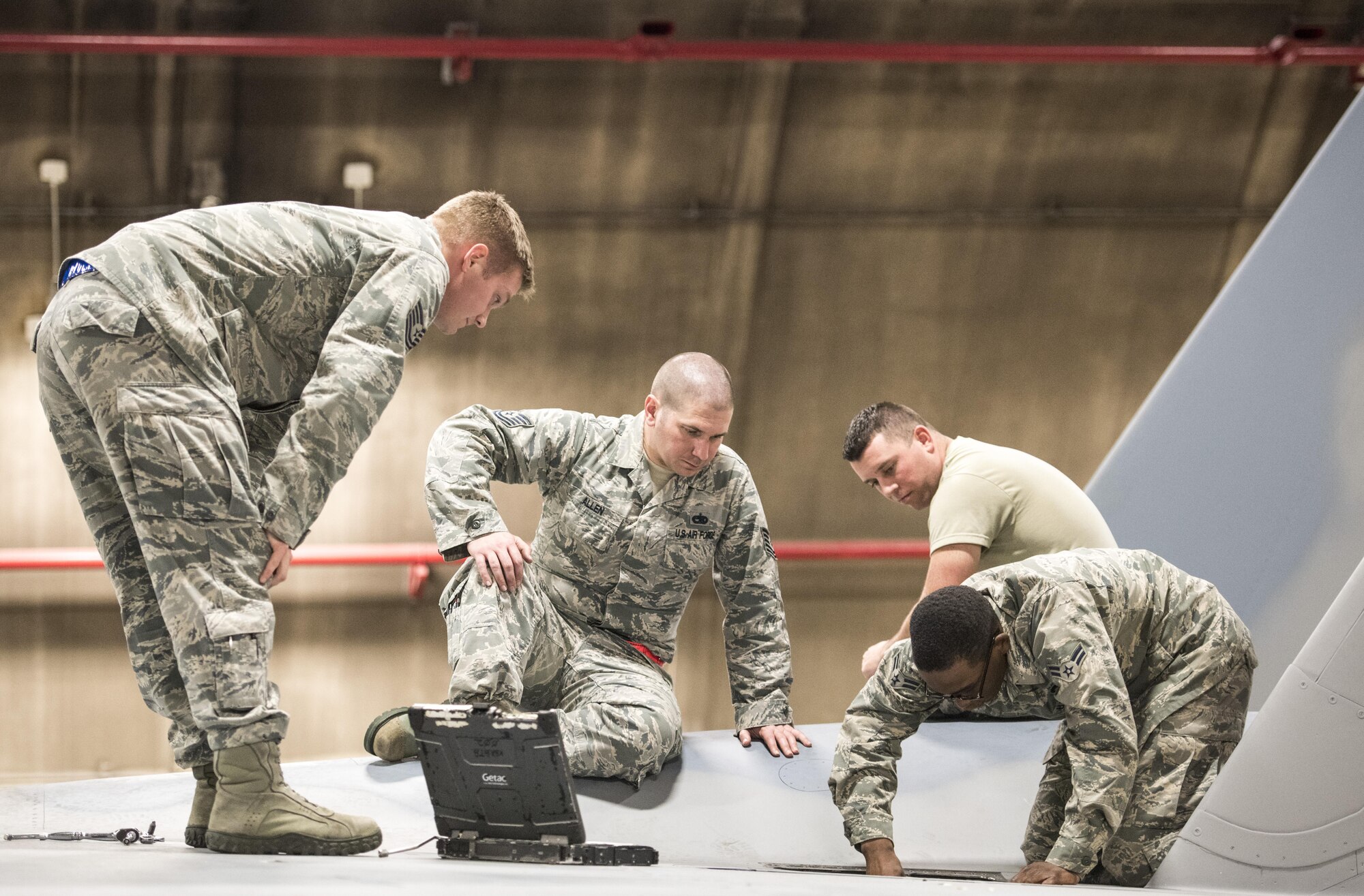 Instructors and training managers from the 18th Maintenance Training Flight, provide hands on training on the flightline Feb. 28, 2017, at Kadena Air Base, Japan. The 18th Maintenance Training Flight introduced a new core task for new electrical and environmental maintainers station on Kadena. (U.S. Air Force photo by Senior Airman Omari Bernard/Released)
