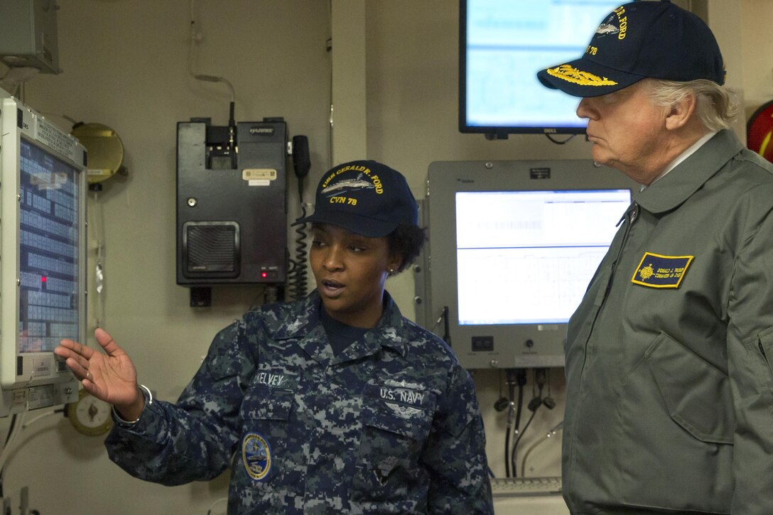 President Donald J. Trump is briefed by a sailor during a tour of the future USS Gerald R. Ford in Newport News, Va., Mar. 2, 2017. Navy photo by Petty Officer 3rd Class Cathrine Mae O. Campbell