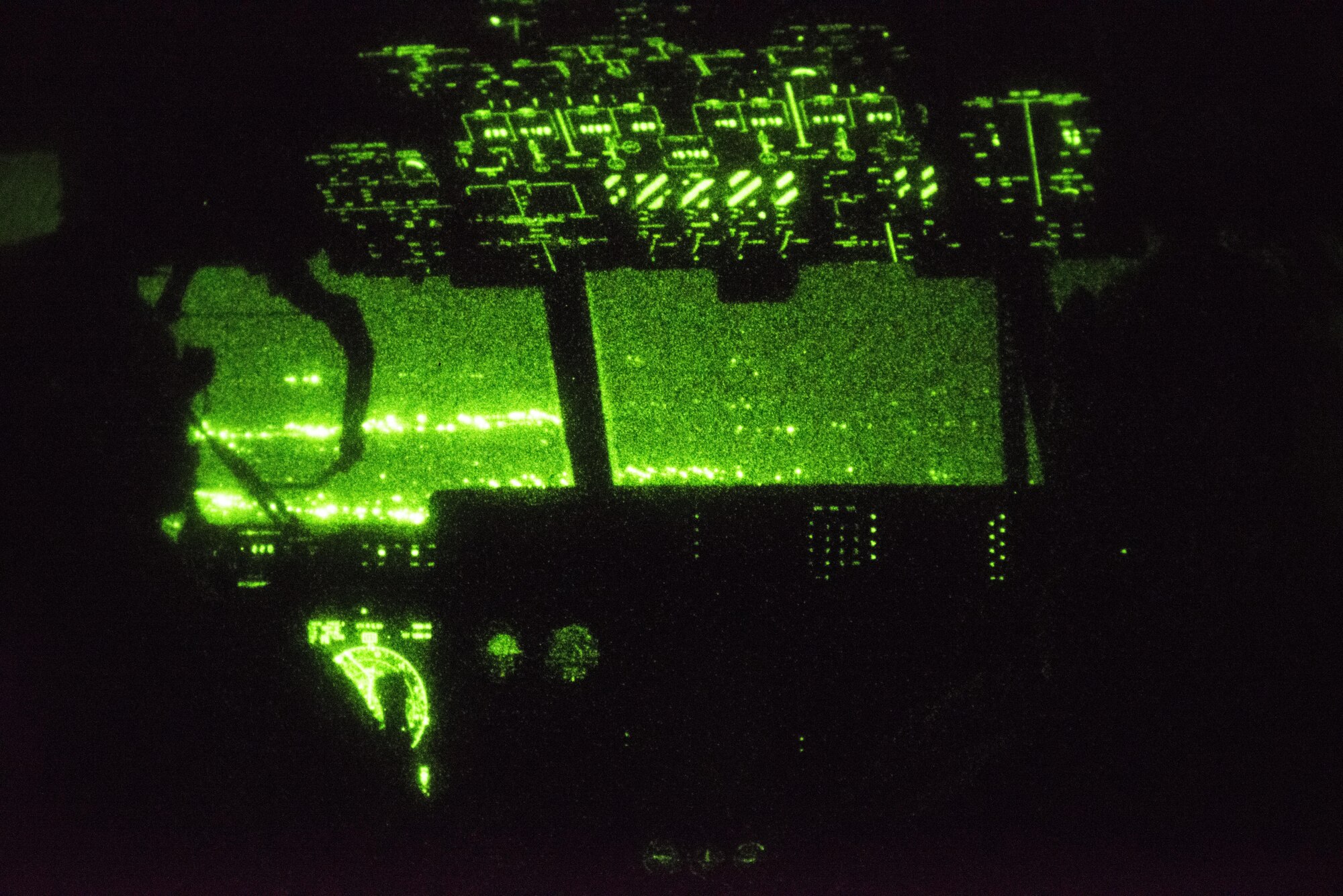 Royal Thai Air Force C-130 pilots from the 601st Squadron were invited to observe nighttime flying operations on an MC-130J Commando II, Feb. 14, 2017 at Korat Air Base, Thailand. Experts in specialized aviation, the 17th Special Operations Squadron provided academic lessons on flying with night vision goggles (NVG) to various RTAF and USAF units during Cobra Gold 2017. (U.S. Air Force photo by Capt. Jessica Tait)