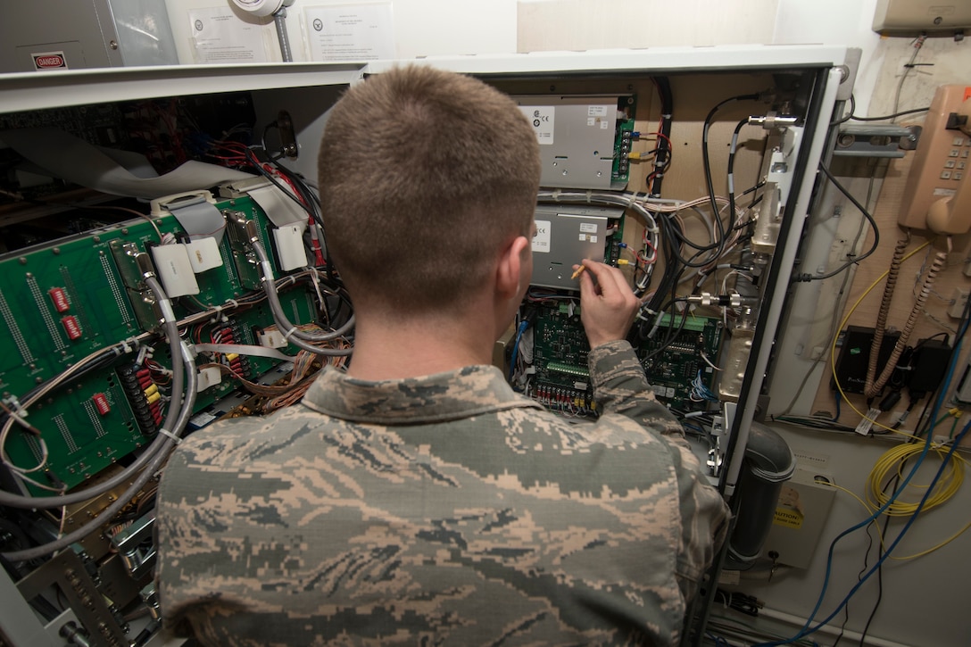 U.S. Air Force Airman 1st Class Tristan Blake, a 35th Operations Support Squadron airfield systems technician, performs a check on an instrument landing system at Misawa Air Base, Japan, Feb. 28, 2017. The ILS provides horizontal and vertical guidance for pilots landing and taking off. Airfield systems technicians periodically perform preventative maintenance inspections on equipment to ensure serviceability. (U.S. Air Force photo by Airman 1st Class Sadie Colbert)