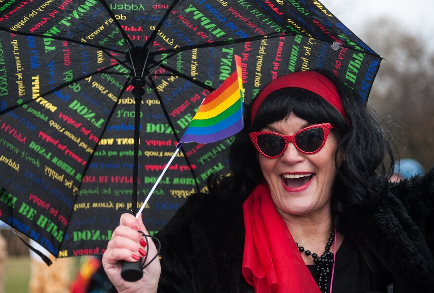 A woman waves a rainbow flag during fasching, a festival held across Europe, in the city of Ramstein, Germany, Feb. 28, 2017. The festival has been recognized and celebrated since the 13th century. Written records show the first carnival was held in 1341 in Köln, Germany. (U.S. Air Force photo by Senior Airman Lane T. Plummer) 