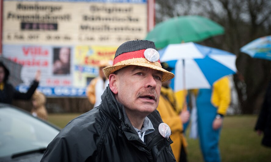 A man walks through a parade during fasching, a festival held across Europe, in the city of Ramstein, Germany, Feb. 28, 2017. These festivals are associated with festivals of the Christian church, however, they go further back to Pagan times, and was a way of driving out the evil spirits of winter and encouraging the coming of spring and good crops. (U.S. Air Force photo by Senior Airman Lane T. Plummer)