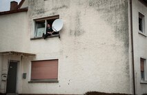 A man sits on his windowsill to observe the parades outside his apartment during fasching, a festival held across Europe, in the city of Ramstein, Germany, Feb. 28, 2017. These festivals are associated with festivals of the Christian church, however, they go further back to Pagan times, and was a way of driving out the evil spirits of winter and encouraging the coming of spring and good crops. (U.S. Air Force photo by Senior Airman Lane T. Plummer)