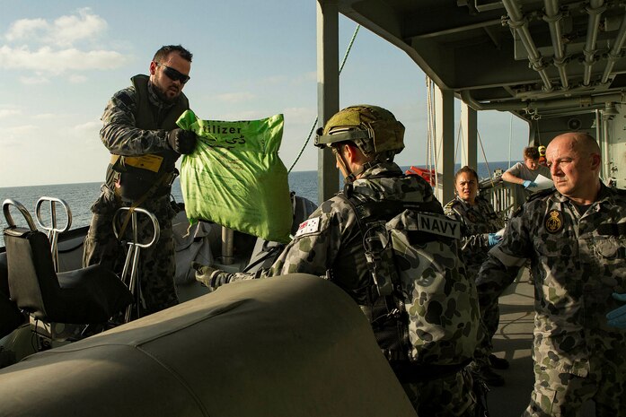 Members of a visit, board, search and seizure (VBSS) team from the Royal Australian Navy Anzac-class frigate HMAS Arunta (FFH 151) seize illicit cargo from a fishing dhow. Arunta seized more than 800 kg of hashish while conducting maritime security operations in the Arabian Sea, March 2. The ANZAC-class frigate made the seizure as part of Combined Task Force (CTF) 150, which was the first intercept of narcotics since December. The Canadian-led CTF 150 is one of three task forces under the U.S.-led Combined Maritime Forces (CMF). 