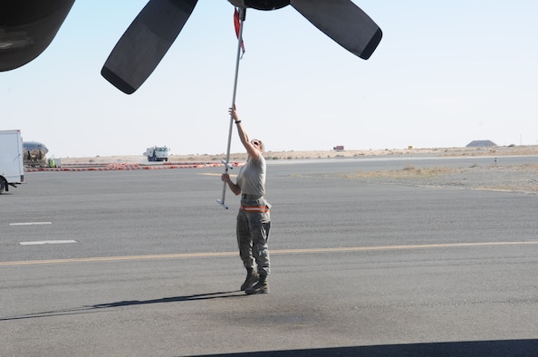 Tech. Sgt. Julie LaRocque, 737th Expeditionary Airlift Squadron crew chief, removes a turbine inlet cover on a C-130H Hercules Feb. 8, 2017 at an undisclosed location in Southwest Asia. LaRocque is deployed from the 120th Airlift Wing, Montana Air National Guard. (U.S. Air Force photo/Tech. Sgt. Kenneth McCann)