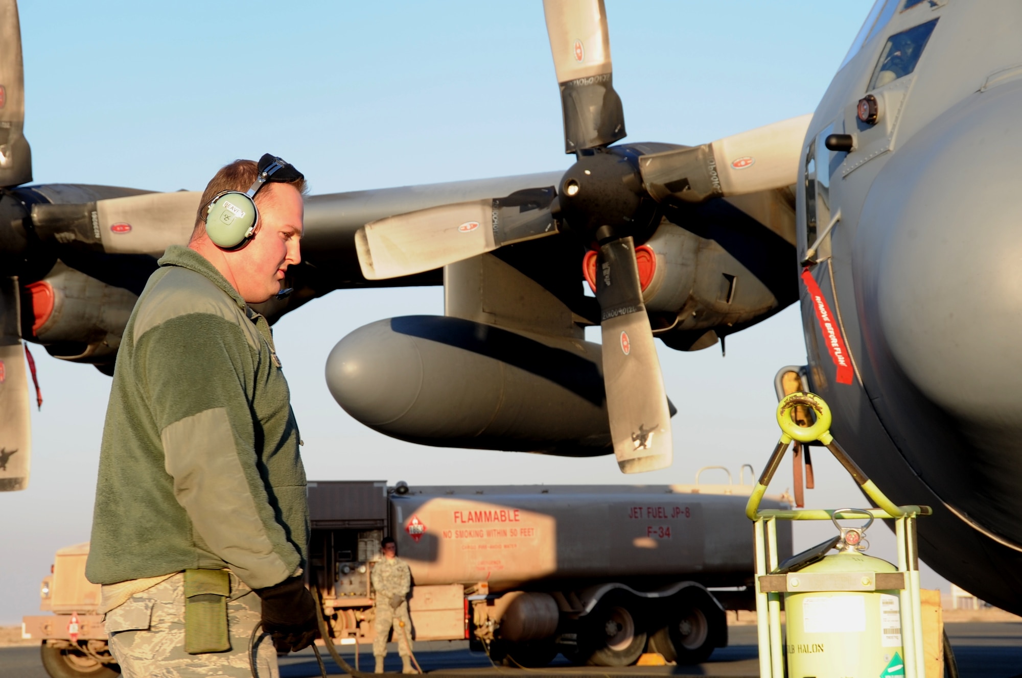 Staff Sgt. Michael Beaver, 737th Expeditionary Air Squadron crew chief, watches over a C-130 Hercules as it gets fueled Feb. 8, 2017 at an undisclosed location in Southwest Asia. The mission of the 737th is to deliver personnel and cargo downrange in support of Operation Inherent Resolve. (U.S. Air Force photo/Tech. Sgt. Kenneth McCann)