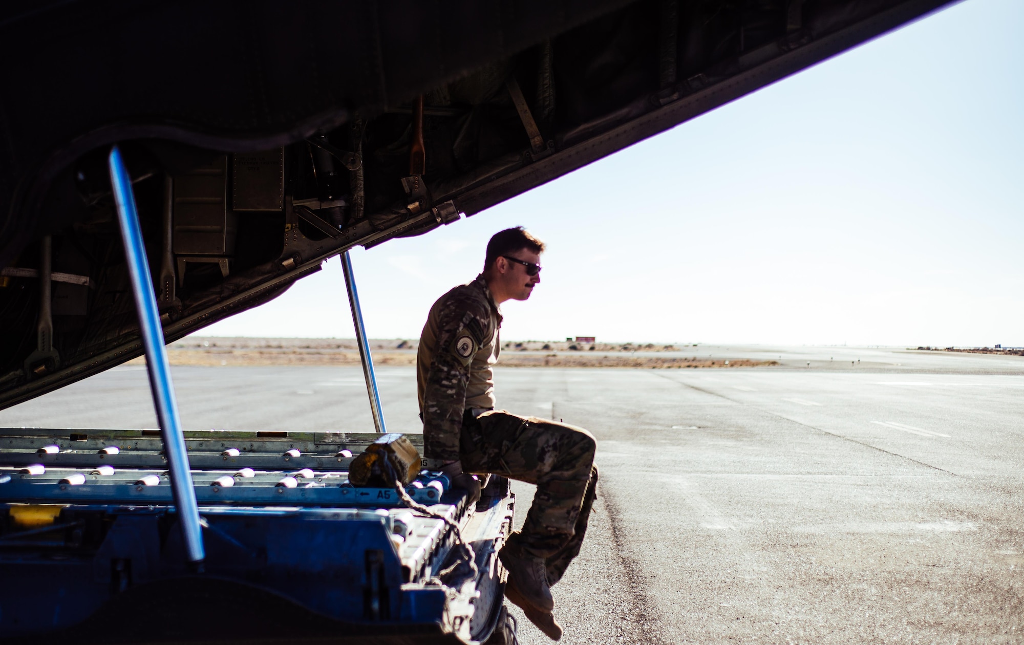 U.S. Air Force Staff Sgt. Nick Barth, 737th Expeditionary Airlift Squadron loadmaster, waits for the remainder of the crew he is flying with to complete preflight checks for a C-130 Hercules before take-off at an undisclosed location in Southwest Asia, Feb. 4, 2017. Barth was part of a team that delivered thousands of pounds in supplies to aid in the fight against Islamic State of Iraq and the Levant and Mosul offensive. (U.S. Air Force photo by Senior Airman Jordan Castelan)