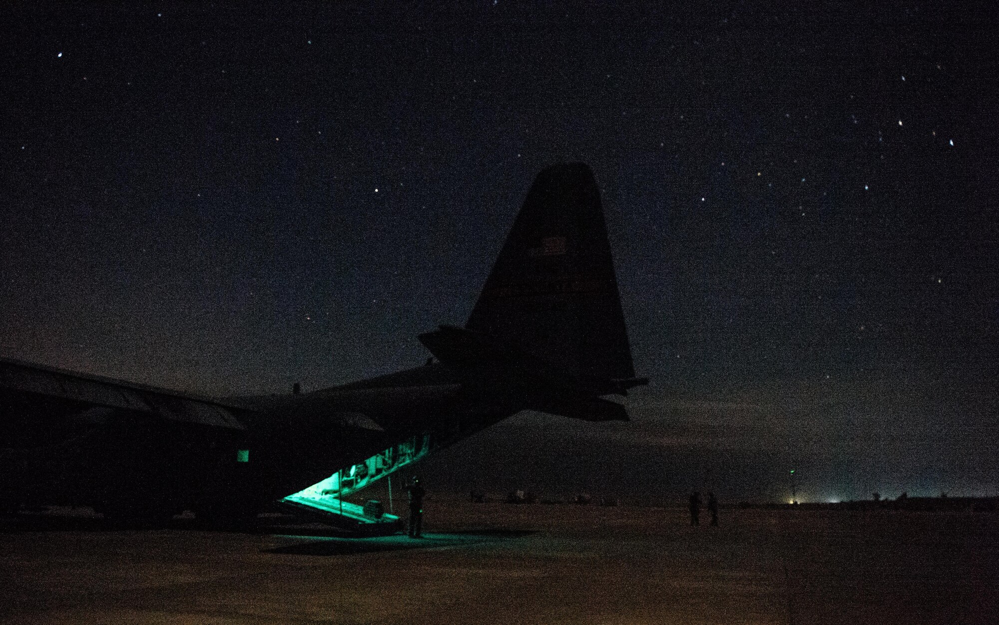 U.S. Air Force Staff Sgt. Nick Barth, 737th Expeditionary Airlift Squadron loadmaster, finishes unloading a C-130 Hercules at Qayyarah West Airfield , Iraq, Feb. 4, 2017. Barth was part of a team that delivered thousands of pounds in supplies to aide in the fight against the Islamic State of Iraq and the Levant and Mosul offensive. (U.S. Air Force photo by Senior Airman Jordan Castelan)