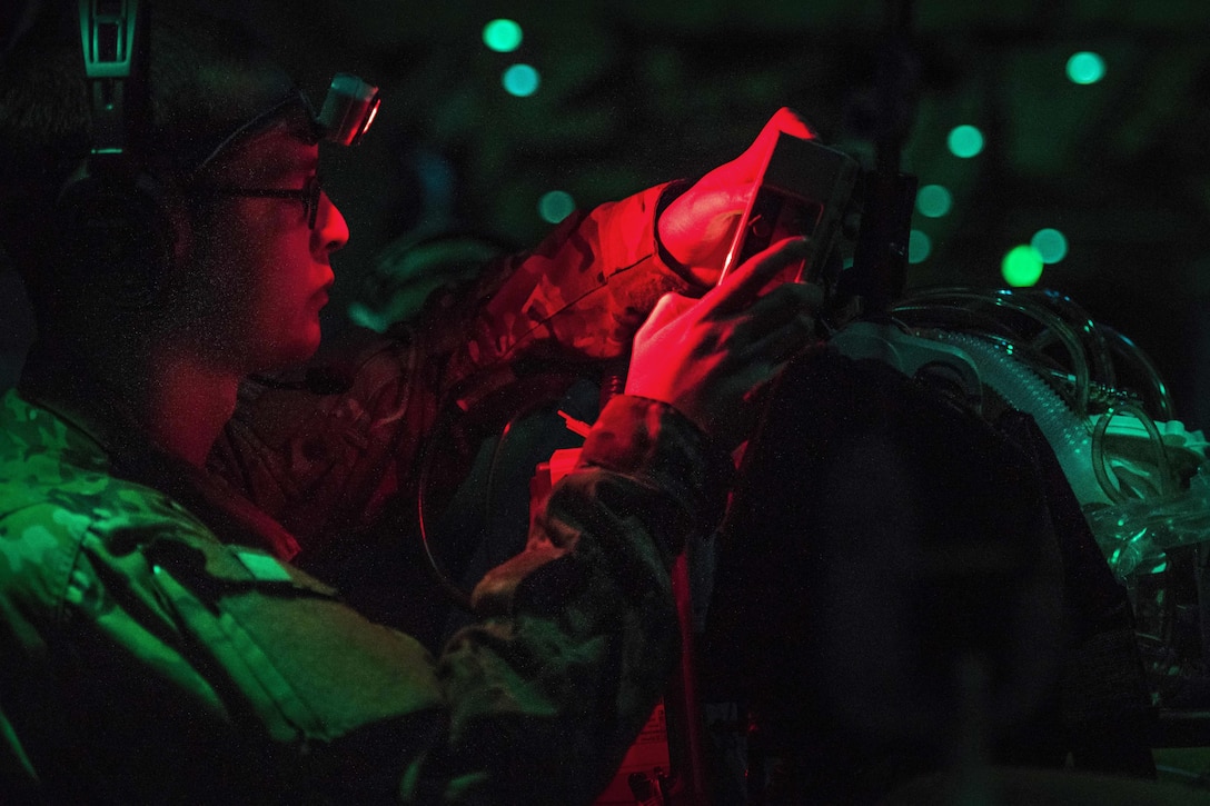 Air Force Capt. Shawn Lawson adjusts a respirator aboard a C-130J Hercules aircraft while transporting a patient from Kandahar Airfield, Afghanistan, to the Craig Joint Theater Hospital at Bagram Airfield, Afghanistan, Feb. 22, 2017. Lawson is a nurse assigned to the 455th Aeromedical Evacuation Squadron. Air Force photo by Staff Sgt. Katherine Spessa