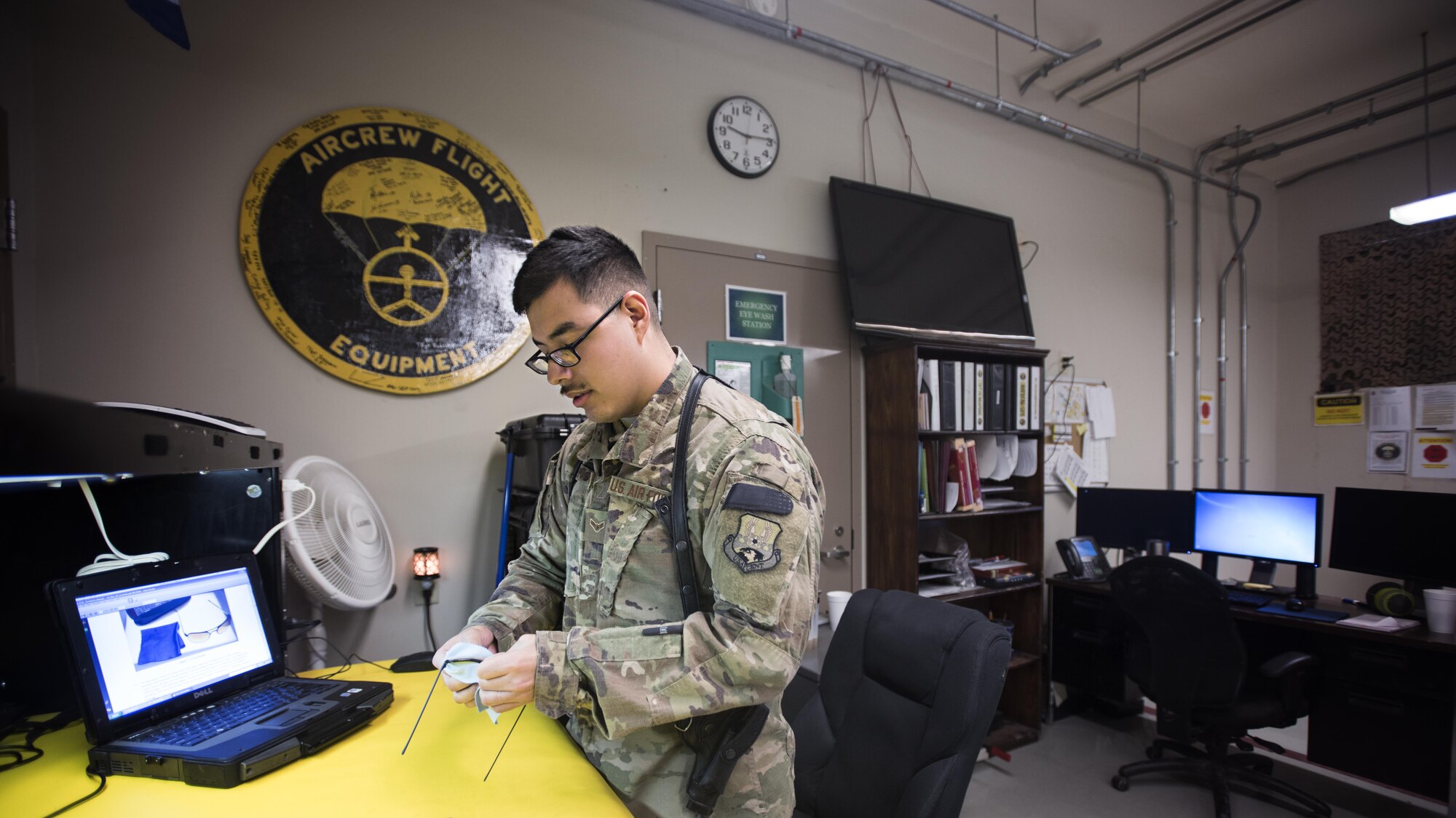 Airman 1st Class Louis Mendoza, 455th Expeditionary Operations Support Squadron aircrew flight equipment journeyman, inspects protective eyewear Feb. 2, 2017 at the 79th Expeditionary Fighter Squadron operations building at Bagram Airfield, Afghanistan. AFE technicians assigned to the fighter squadron are responsible for all of a pilot's flight equipment such as helmet, oxygen mask, harness and all life-saving equipment. (U.S. Air Force photo by Staff Sgt. Katherine Spessa)