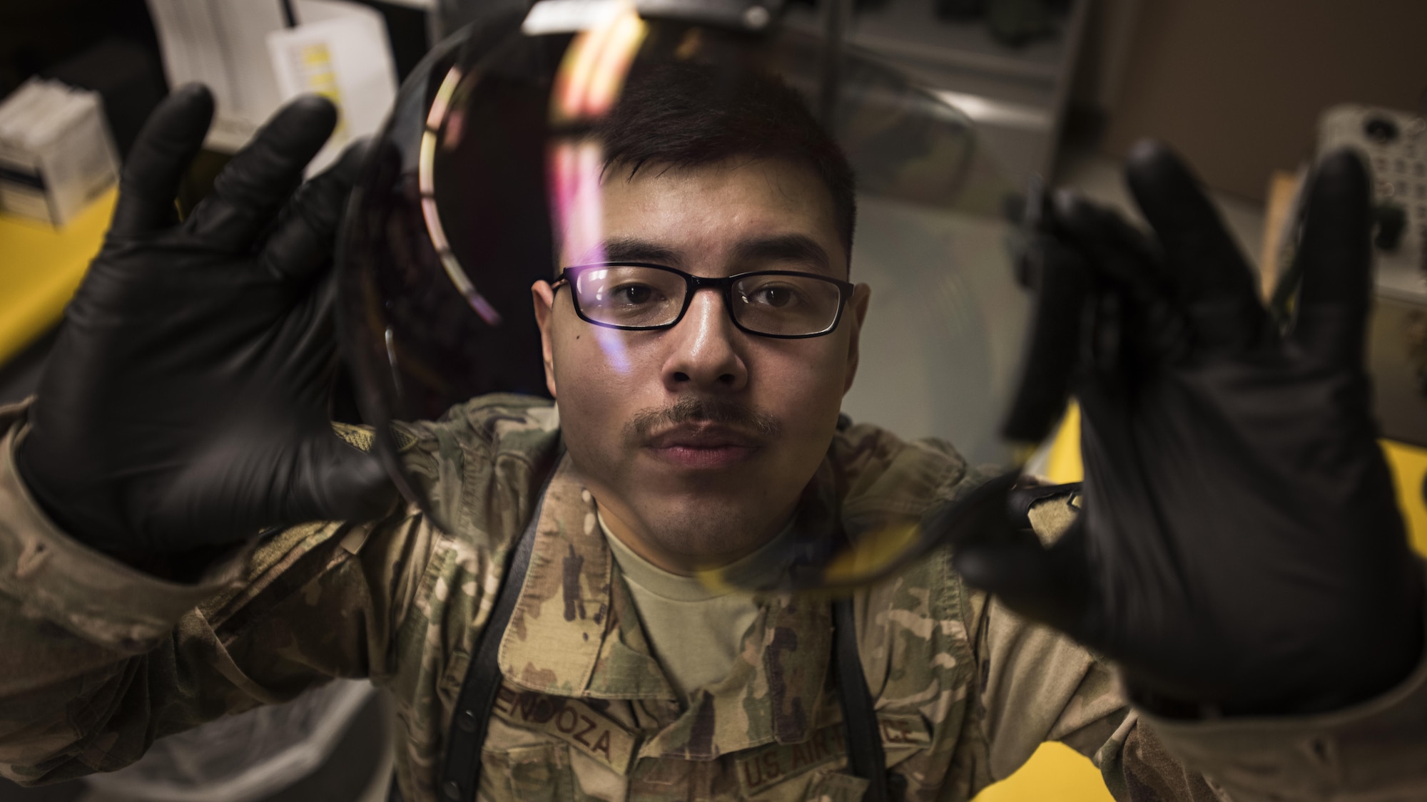 Airman 1st Class Louis Mendoza, 455th Expeditionary Operations Support Squadron aircrew flight equipment journeyman, inspects a pilot’s helmet face shield Feb. 2, 2017 at the 79th Expeditionary Fighter Squadron operations building at Bagram Airfield, Afghanistan. Part of preparing a plane for flight is making sure it's equipped with supplies for any situation. Responsible for ensuring that all flight and safety equipment is in perfect working order, AFE specialists make sure Airmen have the supplies necessary. (U.S. Air Force photo by Staff Sgt. Katherine Spessa)