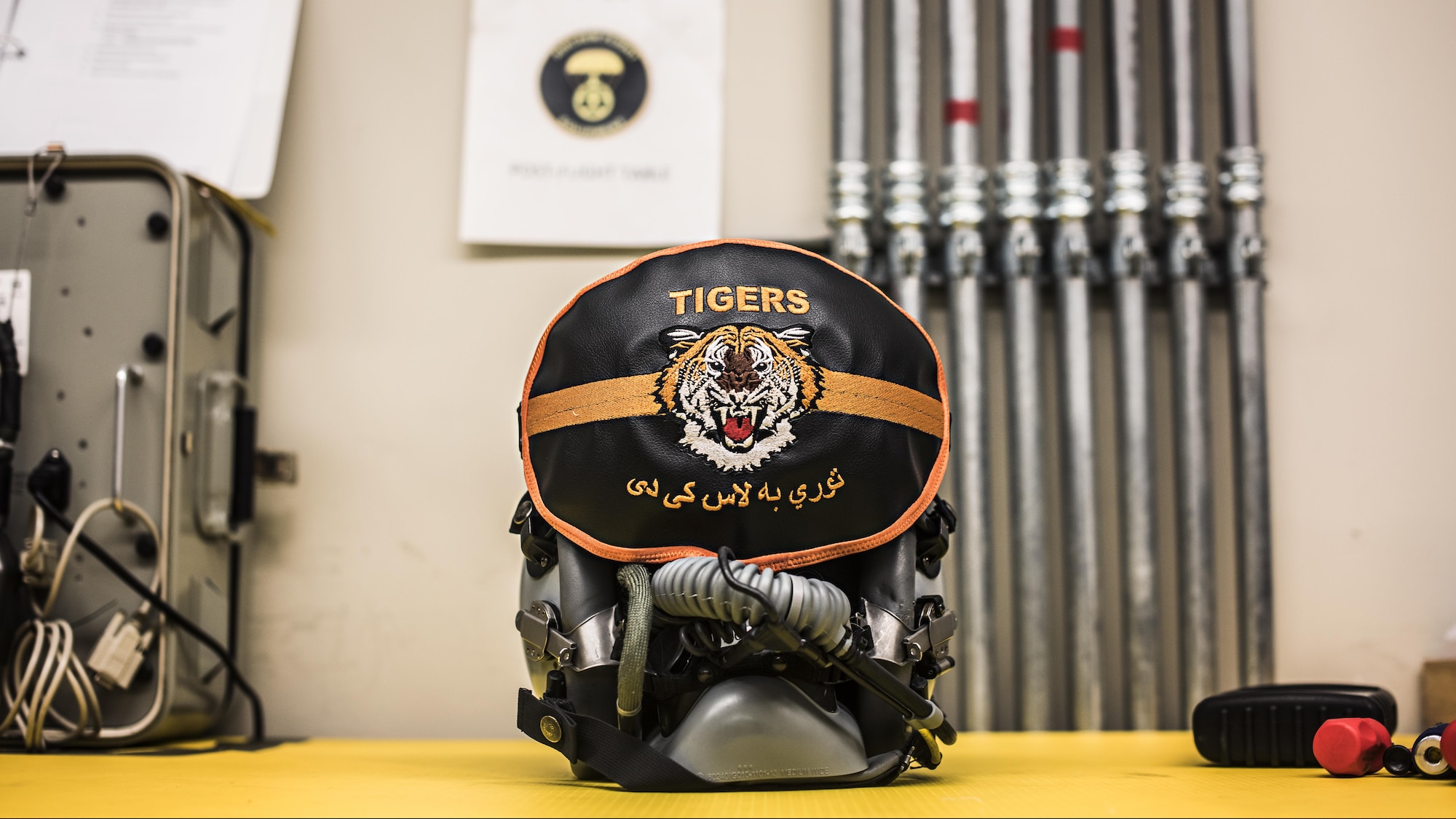 A pilot’s helmet awaits inspection by 455th Expeditionary Operations Support Squadron aircrew flight equipment technicians Feb. 2, 2017 at the 79th Expeditionary Fighter Squadron operations building at Bagram Airfield, Afghanistan. Part of preparing a plane for flight is making sure they’re equipped with supplies for any situation. Responsible for ensuring that all flight and safety equipment is in perfect working order, AFE specialists make sure Airmen have the supplies necessary. (U.S. Air Force photo by Staff Sgt. Katherine Spessa)