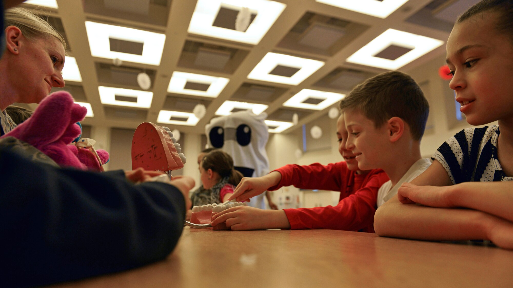 Children participate in brushing teeth during a Children’s Dental Health Month event, Feb. 15, 2017, at Aviano Air Base, Italy. Children’s Dental Health Month was established to educate children on healthy oral hygiene habits. (U.S. Air Force photo by Senior Airman Cary Smith)